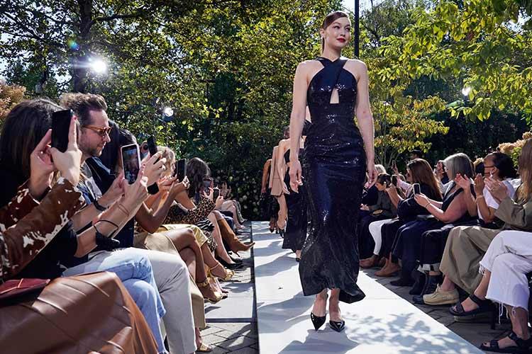 Designer Michael Kors holds first live fashion show since pandemic