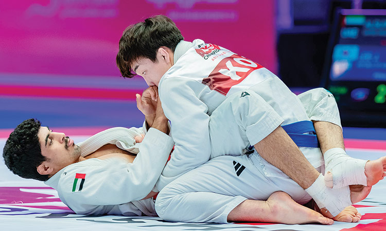 Athletes in action during their fight at the Jiu-Jitsu Asian Championship.
