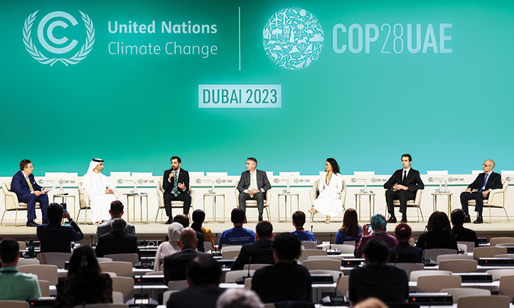 A panel discussion is in progress during COP28 in Dubai on Monday.
