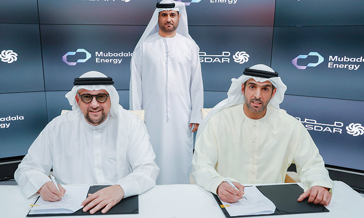 Top officials of Mubadala Energy and Masdar signing the agreement.