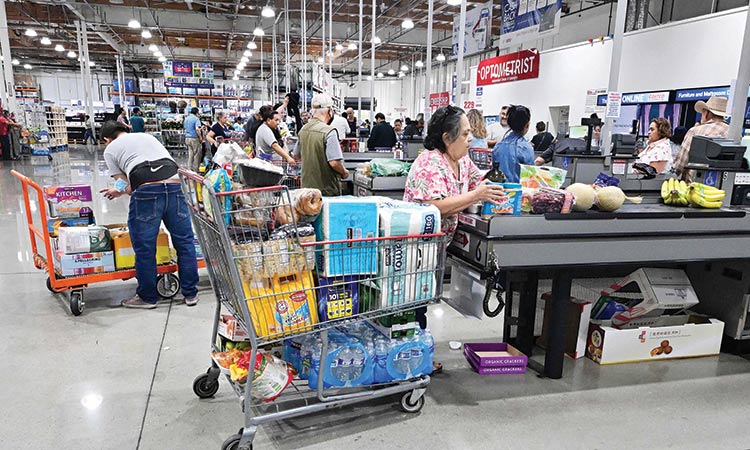 Shoppers place their items on the checkout counter at a wholesale distributor in Alhambra, California, US, on Wednesday.