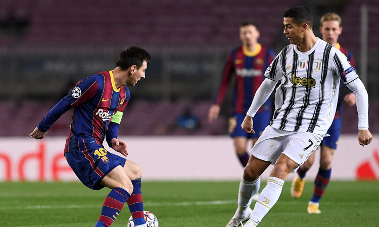 Bruised Ronaldo scores twice to edge showdown with Messi