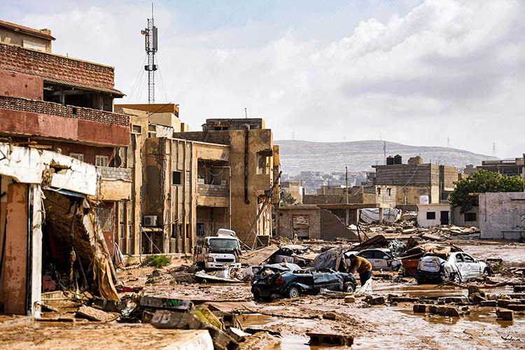 A view of destroyed vehicles and damaged buildings in the eastern city of Derna, Benghazi. AFP