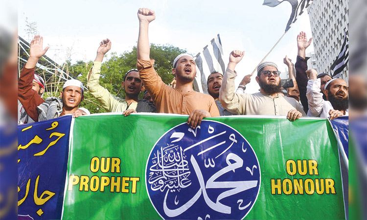 Supporters of Jamiat Ulema-e-Islam Fazal party shout anti-India slogans against the remarks about the Prophet Muhammad (PBUH)  during a demonstration in Karachi on Monday.  Agence France-Presse
