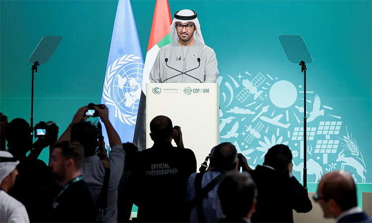 COP28 President Sultan Ahmed Al Jaber addresses the plenary, after a draft of a negotiation deal was released, at the COP28 in Dubai.  Reuters