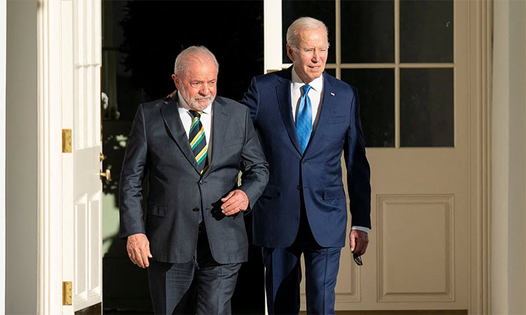 Joe Biden and Luiz Inacio Lula da Silva walk along the West Colonnade to the Oval Office at the White House in Washington. Reuters
