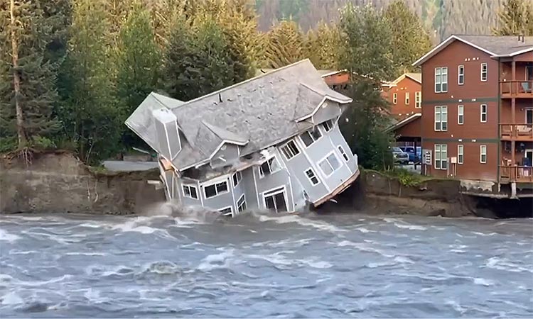 Residents in Juneau were evacuated and homes swept away after flooding caused by a release of water from a glacier-dammed lake.