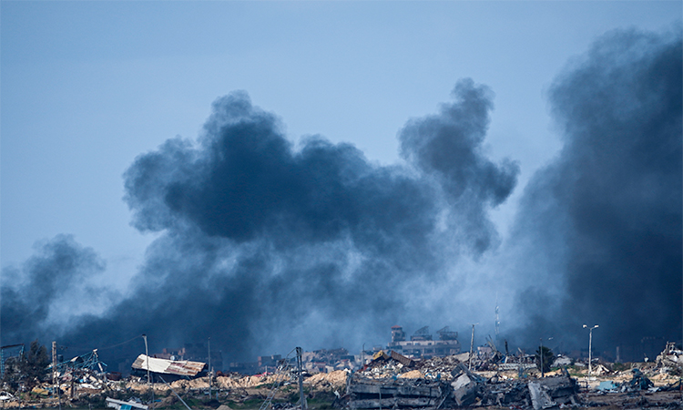 Smoke rises following an Israeli bombardment in the Gaza Strip, as seen from southern Israel.  Associated Press