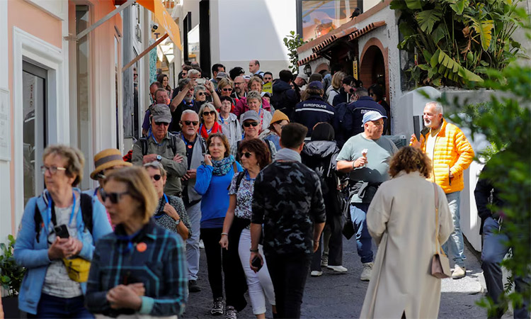People walk in the street on Capri Island, Italy. Reuters   