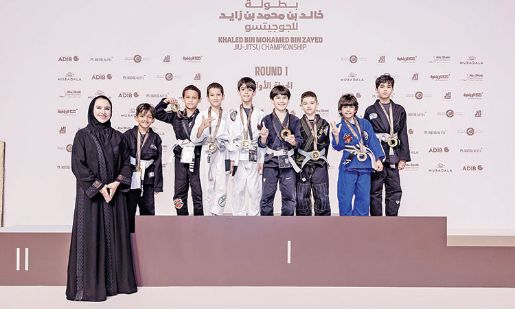 Winners pose for a picture after the presentation ceremony on the second day of the Khaled Bin Mohamed Bin Zayed Jiu-Jitsu Championship.
