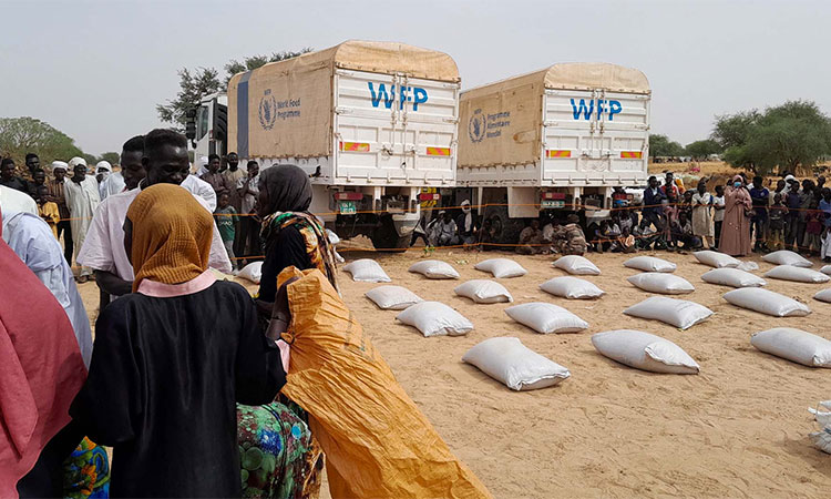The WEF trucks distribute aid to the needy people.