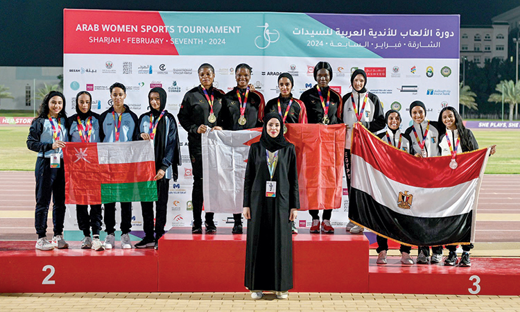 Athletes with Hanan Al Mahmoud, Vice Chairman of the Higher Steering Committee of AWST, during the presentation ceremony.