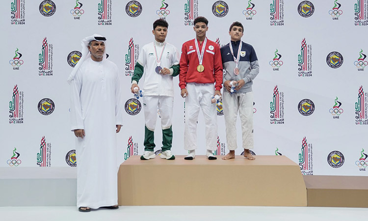 Winners with Nasser Al Tamimi, general secretary of the UAE Wrestling and Judo Federation, during the presentation ceremony.