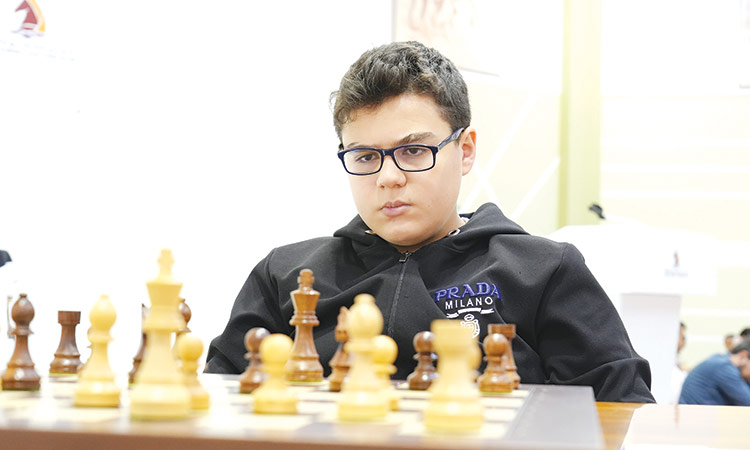 Yagız Kaan Erdogmus ponders a move during his clash against Aronyak Ghosh in the fourth round of the Dubai Open Chess Tournament.