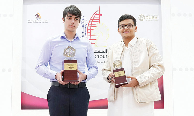 GM Mahammad Muradli (left) and Yousef A. Alhassadi, Category B winner, pose with their trophies.