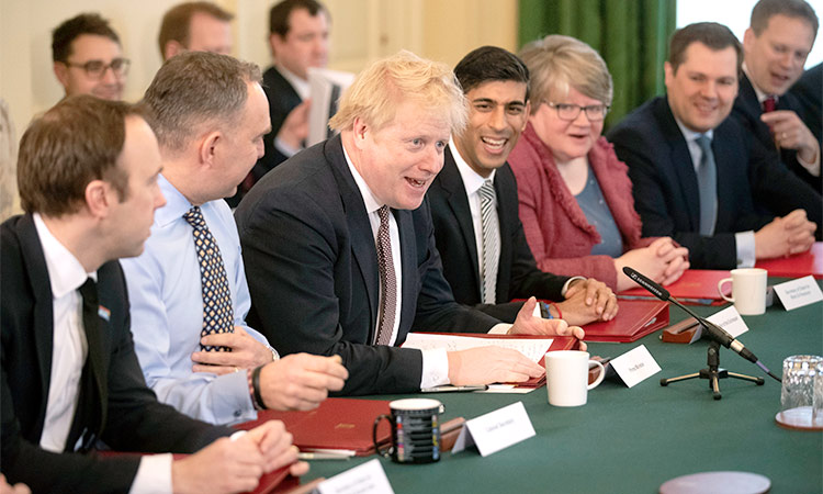 Johnson greets new cabinet, vows to repay trust of voters