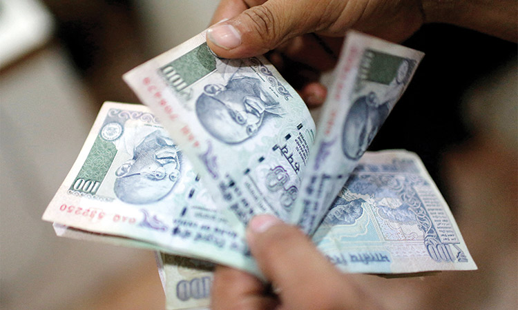 Rupee little changed, bucks regional volatility trends ahead of US election