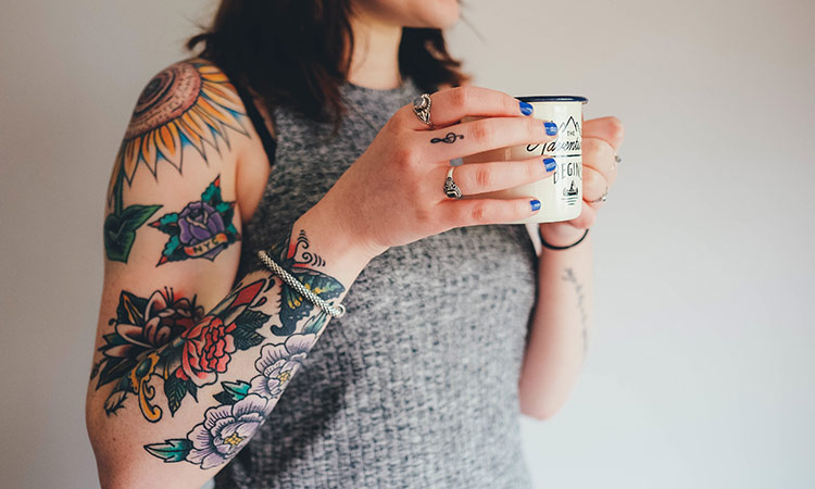 Why does the topic of tattoos provoke debate?