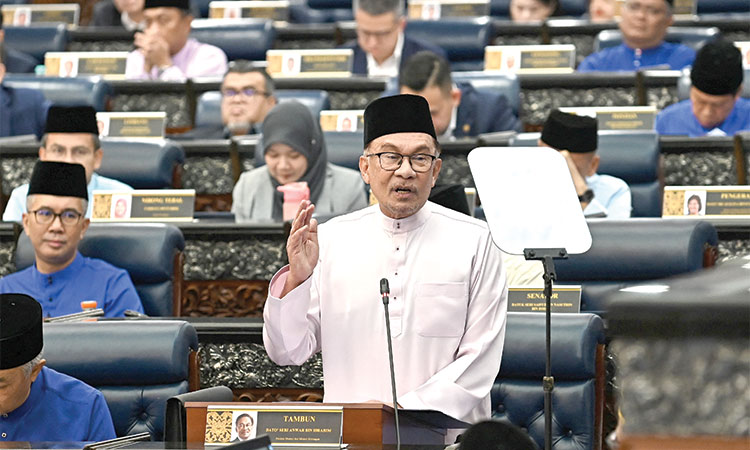 Malaysia unveils new taxes, cuts  subsidies in 2024 spending plan