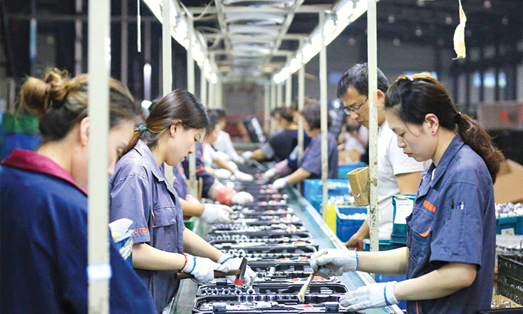 China’s economy stabilises as factory activity records growth