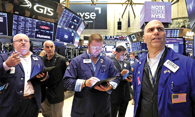 Investors look to earnings to back record-high stock prices