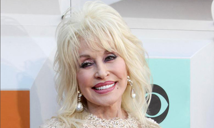 Dolly Parton says she ‘likes to dress up for Carl’ to keep their marriage ‘spicy’