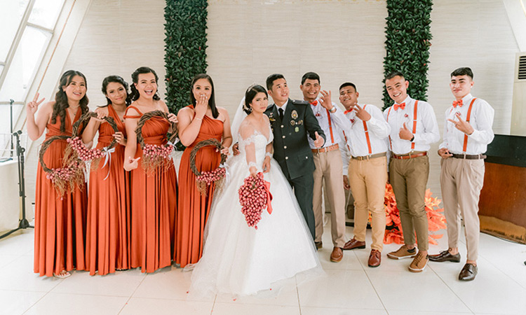 Filipino bride discards flowers, holds bouquet of onions to walk down aisle during her wedding