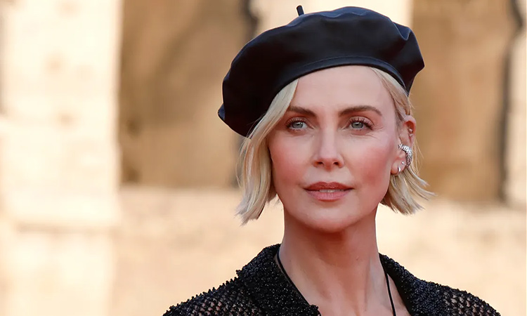 Charlize Theron says she's still recovering from 1990s beauty trends