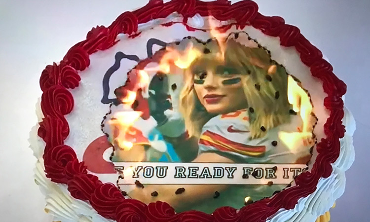 Why would you set a cake on fire? To reveal a Taylor Swift Super Bowl surprise