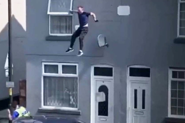 VIDEO: Man cultivating cannabis at home jumps off roof to escape police in England