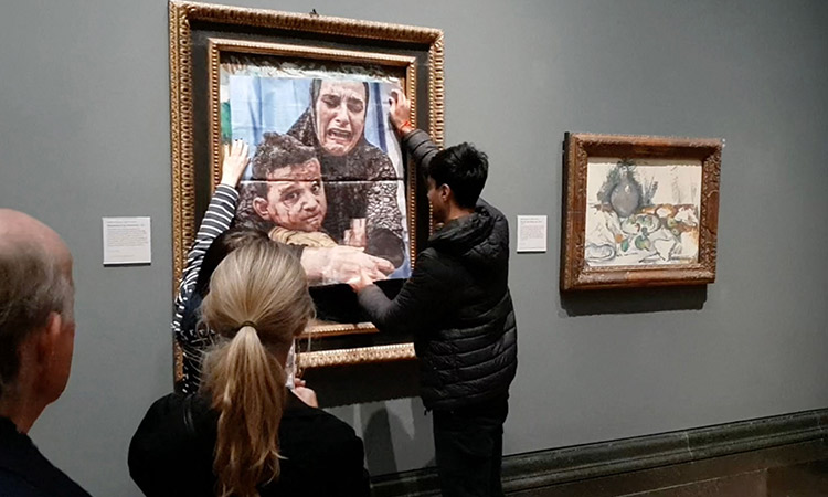 VIDEO: Activists paste picture of Gazan mother and child on Picasso's 'Motherhood' painting at museum in Britain