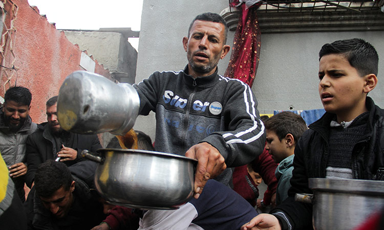 With no chance to celebrate Ramadan, Gazans gather at soup kitchens