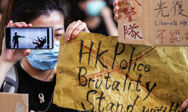 Hong Kong mops up after 180 arrested in violent National Day protests