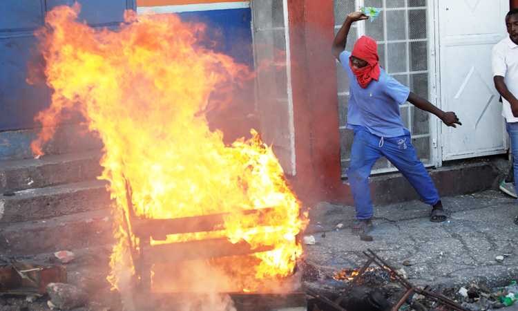 Two dead as hundreds of police, supporters march in Haiti