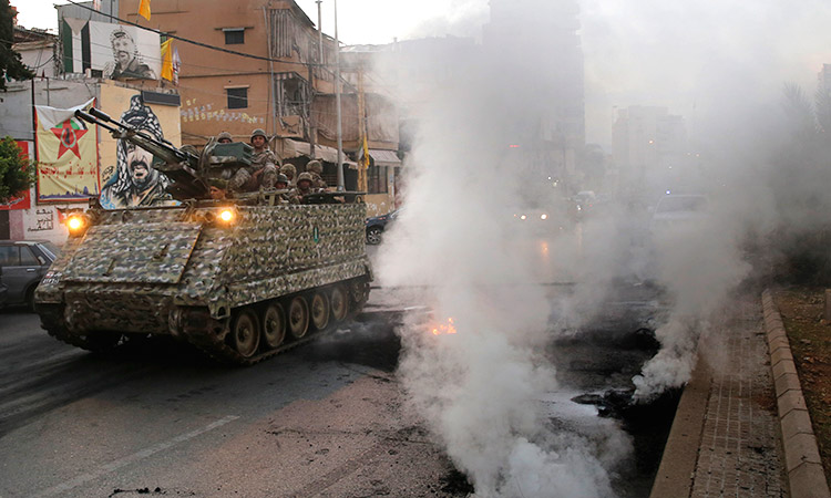 Lebanon protesters block roads to keep revolt alive