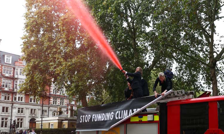 VIDEO: Climate change activists spray fake blood on UK finance ministry building