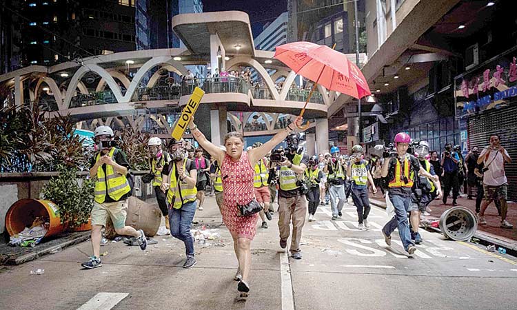 HK rallies erupt as anger mounts over shot protester