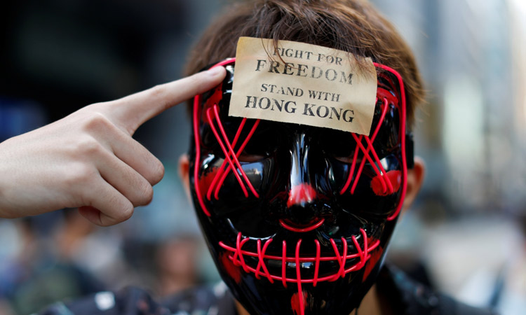 Hong Kong leader invokes emergency powers to ban protester face masks