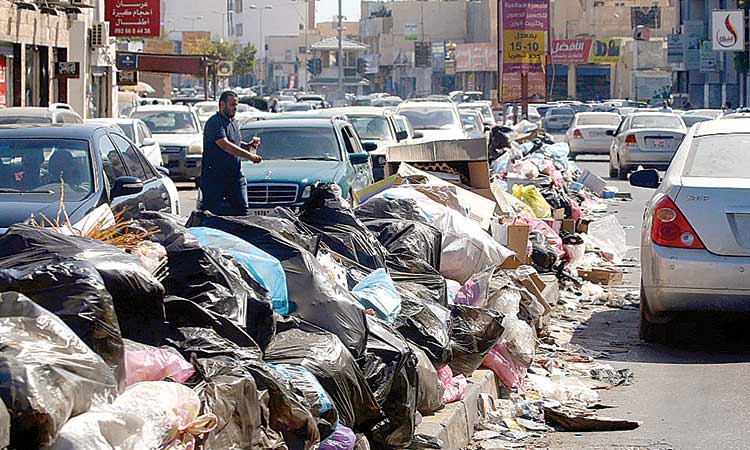 Tripoli streets drown in tonnes of waste