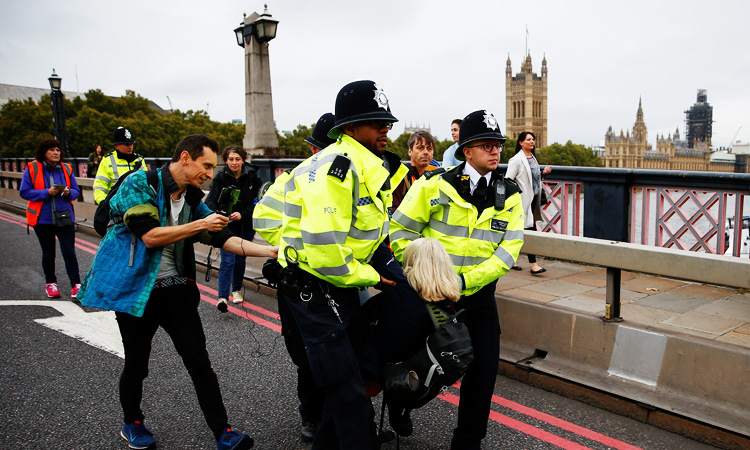 London police arrest 21 climate change protesters as mass action starts