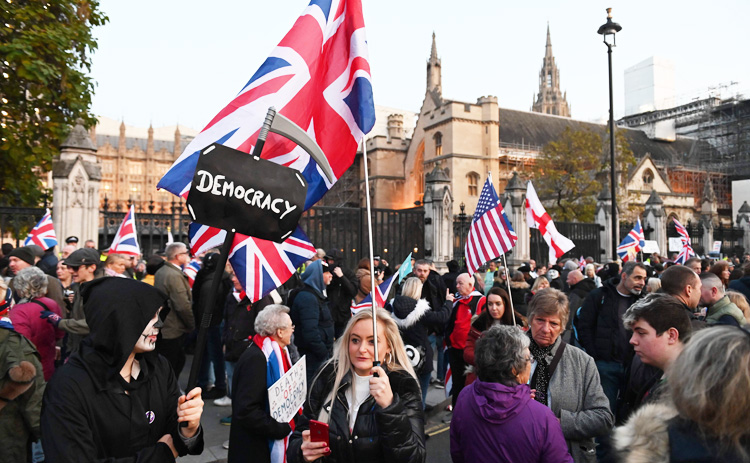 UK defends Brexit deal after Trump trade warning