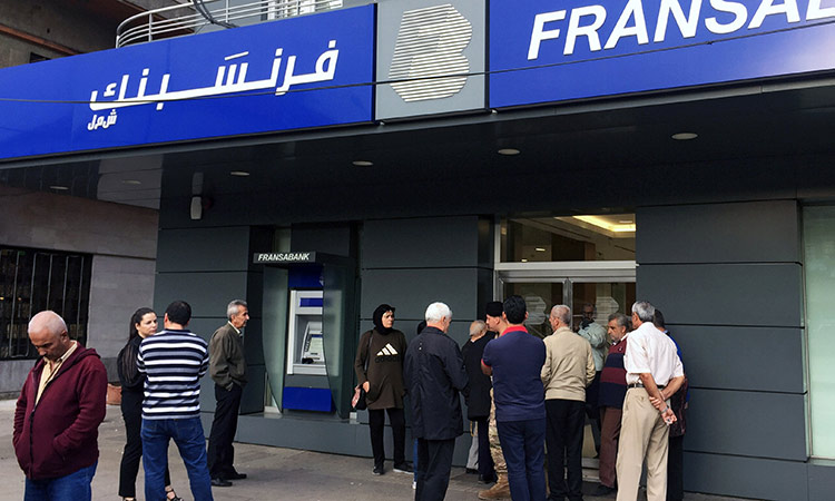 Lebanese banks reopen for first time in two weeks