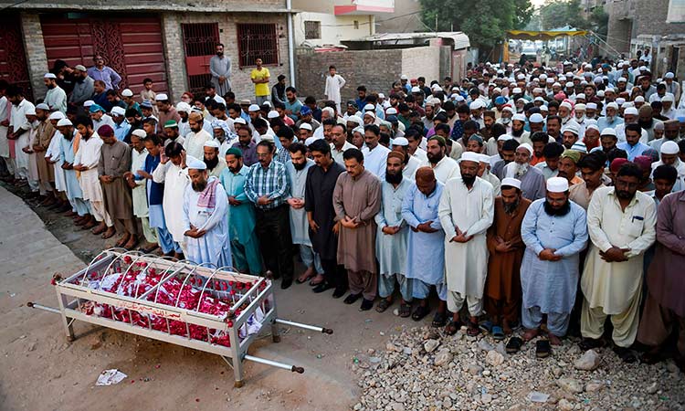 Funerals begin as Pakistan mourns train fire victims