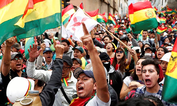 Protesters seize state-run media in Bolivia as tensions soar