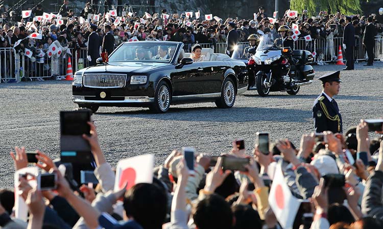 Japan imperial couple rides through Tokyo in grand enthronement parade