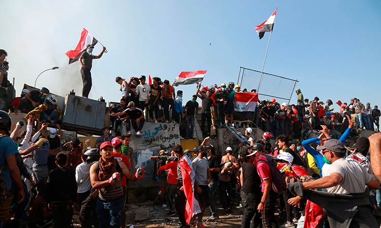 Protesters spill back onto bridge in Iraq capital