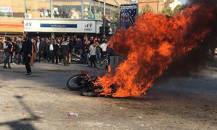 Protests grip major Iran cities over gas prices; 1 killed