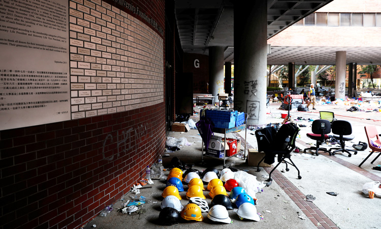 Protesters stay holed up on Hong Kong campus, surrounded by riot police