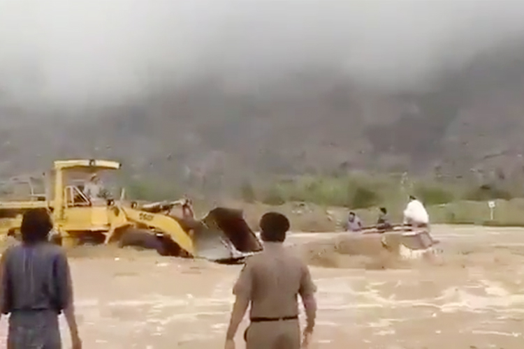 Video of a bulldozer rescuing 3 men trapped in Saudi floods goes viral