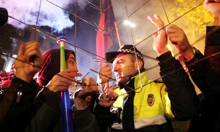 Police in Georgia use water cannon to disperse protesters outside parliament